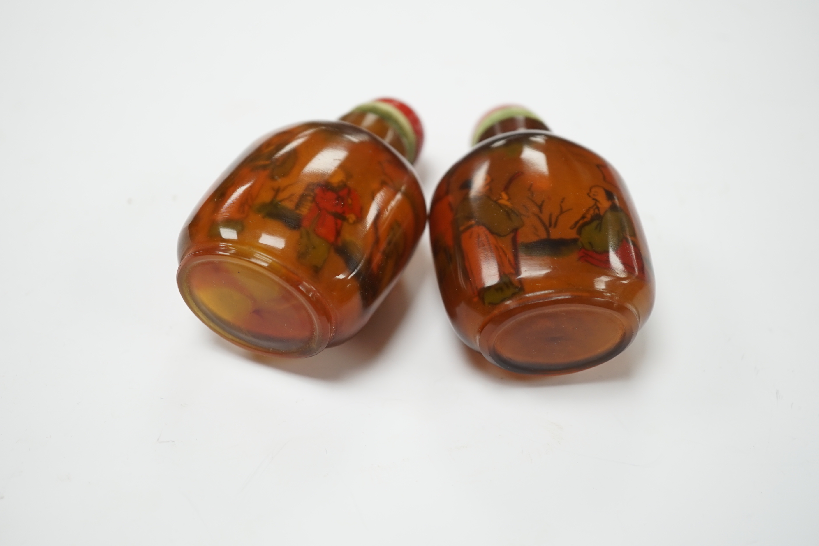 Two Chinese glass snuff bottles, internally painted with figures, 8cm high